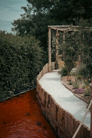 A garden with a red water stream