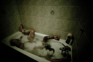 Self-portrait immersed in a bubbling bathtub